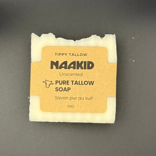 Naakid pure tallow soap bar on a dark gray background